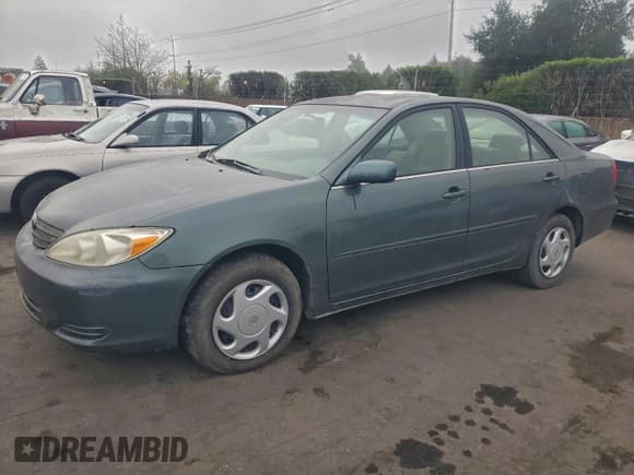 ✅ 2002 Toyota Camry XLE • VIN: JTDBE30K420099583 • Lot: 94325855. Listed on Copart with 202,517 mi. Free auction sales archive from the USA and detailed vehicle history report at DreamBid. Image 1.