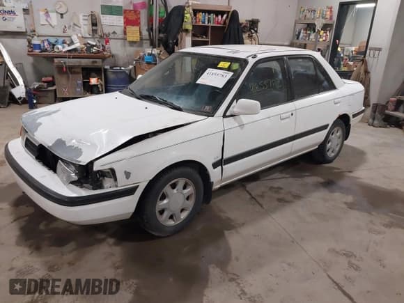 ✅ 1991 Mazda Protege • VIN: JM1BG2267M0278370 • Lot: 41855783. Listed on IAAI with 112,922 mi. Free auction sales archive from the USA and detailed vehicle history report at DreamBid. Image 2.
