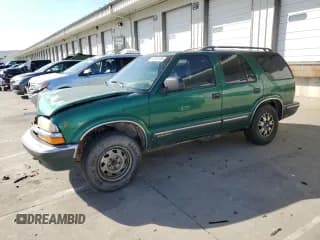 ✅ 1999 Chevrolet Blazer LS • VIN: 1GNDT13W8X2178727 • Lot: 92043155. Listed on Copart with 194,384 mi. Free auction sales archive from the USA and detailed vehicle history report at DreamBid. Image 1.