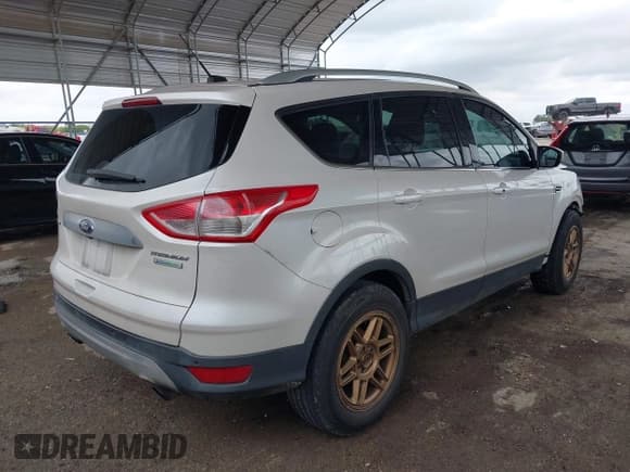✅ 2015 Ford Escape Titanium • VIN: 1FMCU0J91FUA27610 • Lot: 42095995. Listed on IAAI with 122,521 mi. Free auction sales archive from the USA and detailed vehicle history report at DreamBid. Image 4.