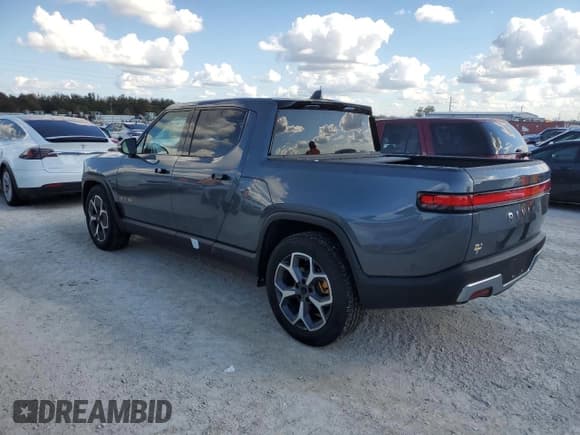 ✅ 2022 Rivian R1T Adventure • VIN: 7FCTGAAA2NN007543 • Lot: 77356644. Listed on Copart with Not provided. Free auction sales archive from the USA and detailed vehicle history report at DreamBid. Image 2.