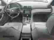 2000 BMW 3 Series 323i with VIN WBAAM3335YCA86464, listed as a Copart auction lot 61687574 with 151,447 mi miles and Salvage title. Bid and sale history available at DreamBid. Image 8.