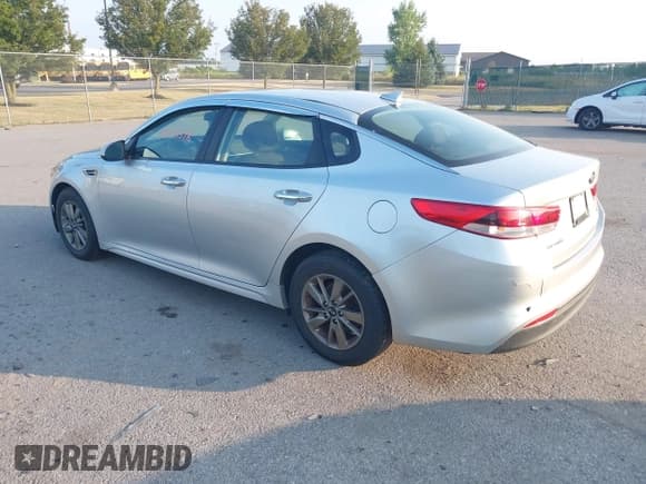 ✅ 2016 Kia Optima LX Turbo • VIN: 5XXGT4L12GG001001 • Lot: 42953378. Listed on IAAI with 187,065 mi. Free auction sales archive from the USA and detailed vehicle history report at DreamBid. Image 3.