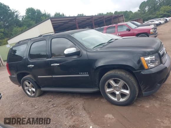 ✅ 2013 Chevrolet Tahoe LTZ • VIN: 1GNSCCE02DR165406 • Lot: 42798022. Listed on IAAI with 212,726 mi. Free auction sales archive from the USA and detailed vehicle history report at DreamBid. Image 13.