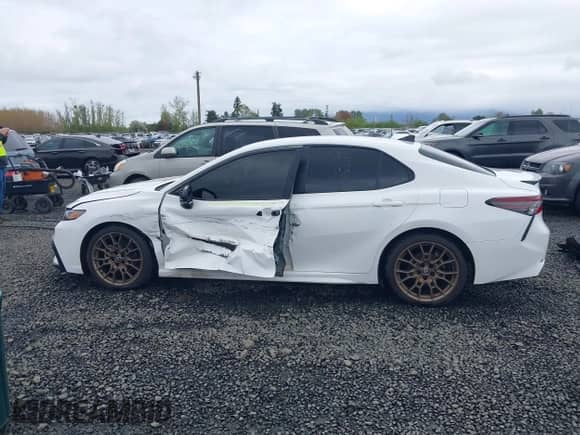 2023 Toyota Camry SE with VIN 4T1G11BKXPU103277, listed as a IAAI auction lot 41978396 with 66,624 mi miles and . Bid and sale history available at DreamBid. Image 14.