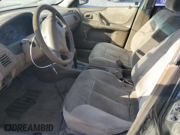 ✅ 1999 Mazda Protege DX • VIN: JM1BJ2221X0172757 • Lot: 75818584. Wystawiony na Copart z przebiegiem 278 032 mil. Bezpłatny archiwum sprzedaży aukcyjnych z USA i szczegółowy raport historii pojazdu na DreamBid. Zdjęcie 7.