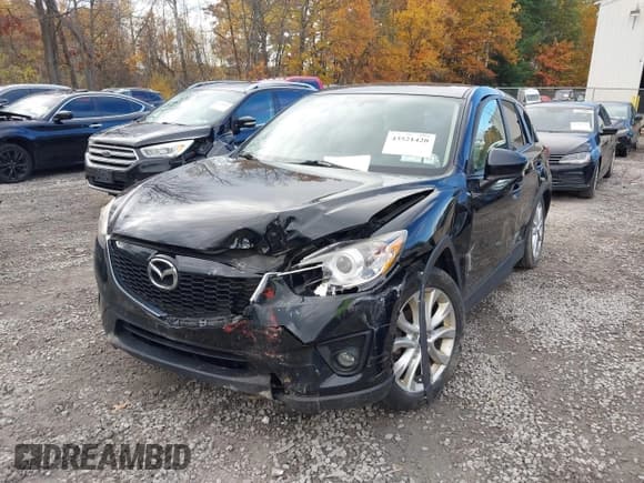 ✅ 2014 Mazda CX-5 Grand Touring • VIN: JM3KE4DY4E0303895 • Lot: 43521420. Listed on IAAI with 167,219 mi. Free auction sales archive from the USA and detailed vehicle history report at DreamBid. Image 6.