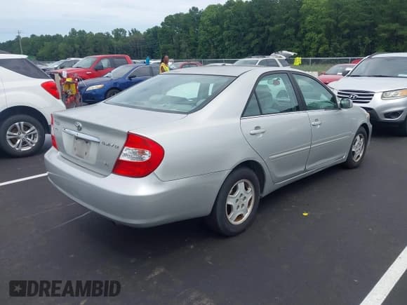 ✅ 2002 Toyota Camry XLE • VIN: 4T1BF32K52U028908 • Лот: 42975341. Опубликован ранее на IAAI с пробегом 355 815 миль. Бесплатный доступ к архиву аукционных продаж из США и подробный отчёт об истории автомобиля на DreamBid. Изображение 4.