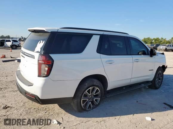 2022 Chevrolet Tahoe Z71 with VIN 1GNSKPKD4NR100687, listed as a Copart auction lot 84206455 with 63,741 mi miles and Salvage title. Bid and sale history available at DreamBid. Image 3.