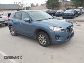 ✅ 2016 Mazda CX-5 Touring • VIN: JM3KE4CY4G0890927 • Lot: 43591262. Wystawiony na IAAI z przebiegiem 153 413 mil. Bezpłatny archiwum sprzedaży aukcyjnych z USA i szczegółowy raport historii pojazdu na DreamBid. Zdjęcie 1.