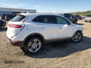 ✅ 2018 Lincoln MKC Reserve • VIN: 5LMCJ3D9XJUL29117 • Lot: 84616585. Listed on Copart with 76,779 mi. Free auction sales archive from the USA and detailed vehicle history report at DreamBid. Image 3.