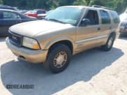 ✅ 1999 GMC Jimmy SLT • VIN: 1GKDT13W7X2545842 • Lot: 42973812. Wystawiony na IAAI z przebiegiem 236 268 mil. Bezpłatny archiwum sprzedaży aukcyjnych z USA i szczegółowy raport historii pojazdu na DreamBid. Zdjęcie 2.