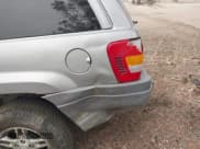 ✅ 2002 Jeep Grand Cherokee • VIN: 1J8GX48S42C147018 • Lot: 43589496. Listed on IAAI with 192,014 mi. Free auction sales archive from the USA and detailed vehicle history report at DreamBid. Image 12.