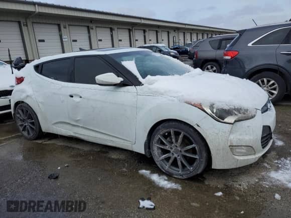 2012 Hyundai Veloster w/Red Int z VIN KMHTC6AD5CU030340, wystawiony jako Copart lot #45793405 z przebiegiem 139 667 mil mil oraz Czysty tytuł • Clean title. Historia ofert i sprzedaży dostępna na DreamBid. Obrazek 4.