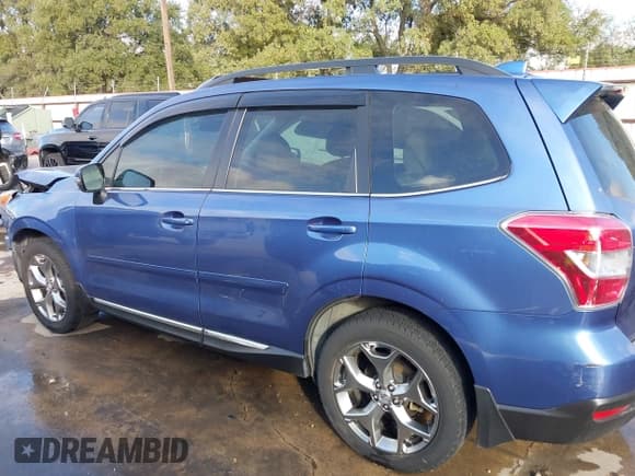 ✅ 2016 Subaru Forester Touring • VIN: JF2SJAXC4GH548334 • Lot: 43258546. Listed on IAAI with 84,361 mi. Free auction sales archive from the USA and detailed vehicle history report at DreamBid. Image 15.