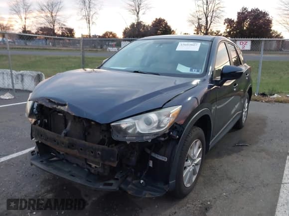 ✅ 2015 Mazda CX-5 Touring • VIN: JM3KE4CY0F0472217 • Lot: 43603807. Listed on IAAI with 159,653 mi. Free auction sales archive from the USA and detailed vehicle history report at DreamBid. Image 2.