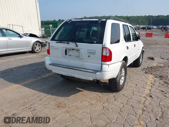 ✅ 2002 Isuzu Rodeo S • VIN: 4S2CK58W524321108 • Lot: 42352330. Listed on IAAI with 270,614 mi. Free auction sales archive from the USA and detailed vehicle history report at DreamBid. Image 4.