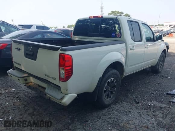 ✅ 2015 Nissan Frontier S • VIN: 1N6AD0EV0FN717018 • Lot: 42322428. Listed on IAAI with 104,715 mi. Free auction sales archive from the USA and detailed vehicle history report at DreamBid. Image 4.