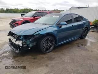 2025 Toyota Camry SE with VIN 4T1DAACK0SU135150, listed as a Copart auction lot 69869815 with 9,735 mi miles and Salvage title. Bid and sale history available at DreamBid. Image 1.