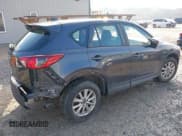 ✅ 2016 Mazda CX-5 Sport • VIN: JM3KE4BY9G0784667 • Lot: 43737851. Listed on IAAI with 151,569 mi. Free auction sales archive from the USA and detailed vehicle history report at DreamBid. Image 4.