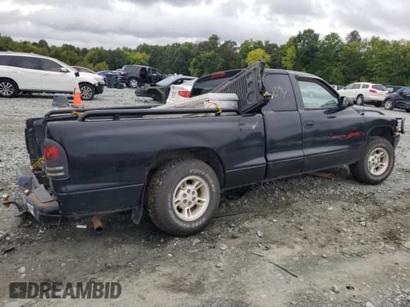 1998 Dodge Dakota SLT z VIN 1B7GL22YXWS651881, wystawiony jako Copart lot #73191384 z przebiegiem Nie podano mil oraz Szkoda całkowita • Salvage title. Historia ofert i sprzedaży dostępna na DreamBid. Obrazek 3.