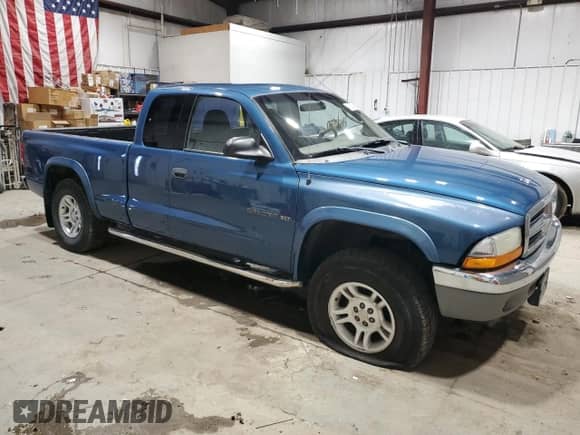 2002 Dodge Dakota SLT with VIN 1B7GG42N62S652834, listed as a Copart auction lot 48002395 with 155,823 mi miles and Clean title. Bid and sale history available at DreamBid. Image 4.