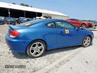 2005 Hyundai Tiburon GS с VIN KMHHM65DX5U168343, выставлен на аукционе Copart как лот 58749085 с пробегом Не указан миль и Чистый • Clean title. История ставок и продаж доступна на DreamBid. Изображение 3.