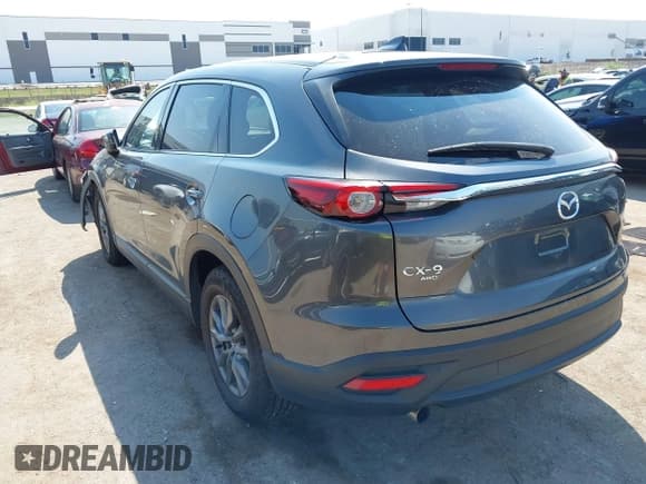 ✅ 2023 Mazda CX-9 Touring • VIN: JM3TCBCY1P0647669 • Lot: 43271567. Listed on IAAI with 39,982 mi. Free auction sales archive from the USA and detailed vehicle history report at DreamBid. Image 3.
