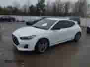 2019 Hyundai Veloster 2.0 z VIN KMHTG6AF7KU017934, wystawiony jako IAAI lot #41700835 z przebiegiem 50 594 mil mil oraz . Historia ofert i sprzedaży dostępna na DreamBid. Obrazek 2.