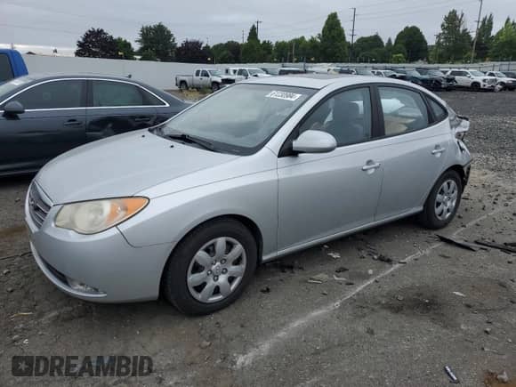 2007 Hyundai Elantra GLS with VIN KMHDU46DX7U084981, listed as a Copart auction lot 61230984 with 93,887 mi miles and Salvage title. Bid and sale history available at DreamBid. Image 1.