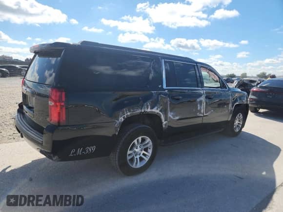 2019 Chevrolet Suburban LT z VIN 1GNSCHKCXKR161435, wystawiony jako Copart lot #90894635 z przebiegiem 189 459 mil mil oraz Czysty tytuł • Clean title. Historia ofert i sprzedaży dostępna na DreamBid. Obrazek 3.