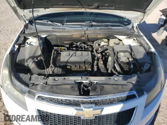 2014 Chevrolet Cruze 1LT z VIN 1G1PC5SB5E7435668, wystawiony jako Copart lot #86121945 z przebiegiem 82 481 mil mil oraz Szkoda całkowita • Salvage title. Historia ofert i sprzedaży dostępna na DreamBid. Obrazek 11.