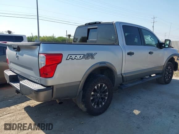 ✅ 2018 Nissan Titan Pro-4X • VIN: 1N6AA1E51JN551695 • Lot: 43365881. Listed on IAAI with 114,790 mi. Free auction sales archive from the USA and detailed vehicle history report at DreamBid. Image 4.