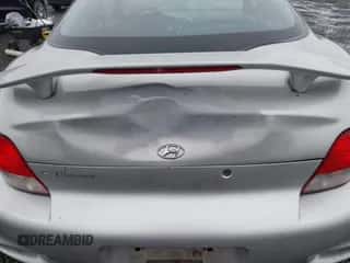 2001 Hyundai Tiburon z VIN KMHJG25F81U267658, wystawiony jako IAAI lot #41092438 z przebiegiem 188 575 mil mil oraz . Historia ofert i sprzedaży dostępna na DreamBid. Obrazek 6.