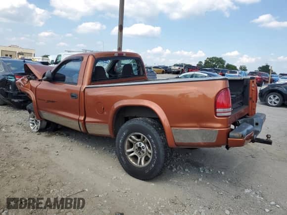 2001 Dodge Dakota Sport z VIN 1B7GG26N31S197440, wystawiony jako Copart lot #68280665 z przebiegiem Nie podano mil oraz Szkoda całkowita • Salvage title. Historia ofert i sprzedaży dostępna na DreamBid. Obrazek 2.