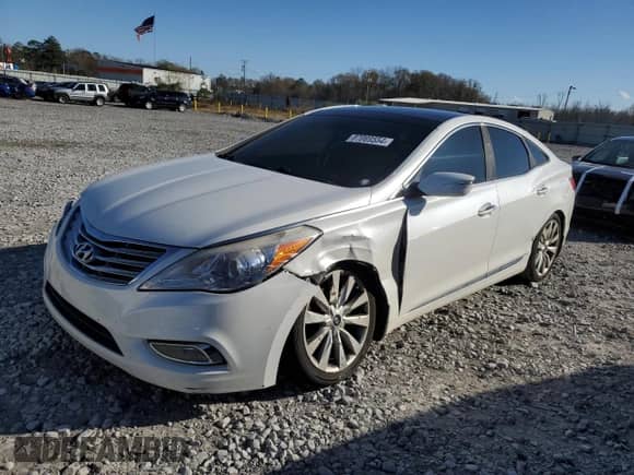 2013 Hyundai Azera z VIN KMHFH4JG7DA321468, wystawiony jako Copart lot #87069554 z przebiegiem 147 382 mil mil oraz Szkoda całkowita • Salvage title. Historia ofert i sprzedaży dostępna na DreamBid. Obrazek 1.