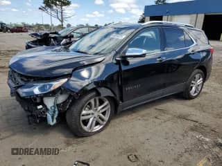 2018 Chevrolet Equinox Premier z VIN 2GNAXNEX1J6296455, wystawiony jako Copart lot #65510325 z przebiegiem 93 930 mil mil oraz Szkoda całkowita • Salvage title. Historia ofert i sprzedaży dostępna na DreamBid. Obrazek 1.