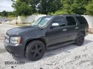 2014 Chevrolet Tahoe LT z VIN 1GNSCBE00ER157347, wystawiony jako Copart lot #61904115 z przebiegiem 164 511 mil mil oraz Szkoda całkowita • Salvage title. Historia ofert i sprzedaży dostępna na DreamBid. Obrazek 1.