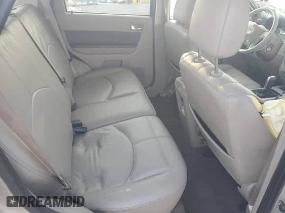 2010 Mercury Mariner Premier с VIN 4M2CN9HG4AKJ12675, выставлен на аукционе Copart как лот 71417445 с пробегом Не указан миль и Списание • Salvage title. История ставок и продаж доступна на DreamBid. Изображение 11.