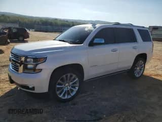 2019 Chevrolet Tahoe Premier with VIN 1GNSKCKJ7KR185406, listed as a Copart auction lot 84976965 with 113,571 mi miles and Salvage title. Bid and sale history available at DreamBid. Image 1.