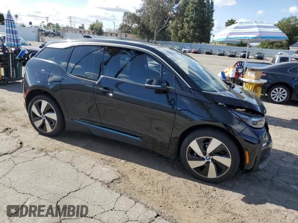 ✅ 2018 BMW i3 • VIN: WBY7Z2C58JVE64683 • Lot: 56817895. Listed on Copart with 50,993 mi. Free auction sales archive from the USA and detailed vehicle history report at DreamBid. Image 4.