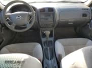 ✅ 2000 Mazda Protege DX • VIN: JM1BJ2220Y0239835 • Lot: 80228864. Wystawiony na Copart z przebiegiem 200 936 mil. Bezpłatny archiwum sprzedaży aukcyjnych z USA i szczegółowy raport historii pojazdu na DreamBid. Zdjęcie 8.