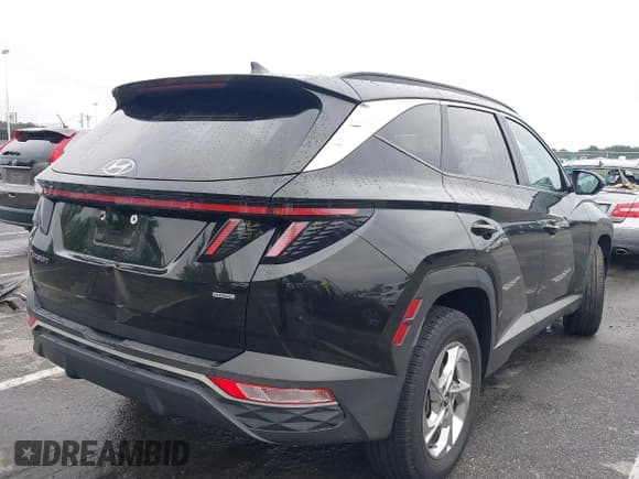 ✅ 2022 Hyundai Tucson SEL • VIN: KM8JBCAE6NU031615 • Lot: 42887395. Listed on IAAI with 63,078 mi. Free auction sales archive from the USA and detailed vehicle history report at DreamBid. Image 4.
