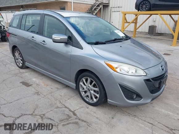 ✅ 2014 Mazda 5 Touring • VIN: JM1CW2CL7E0175902 • Lot: 43287647. Listed on IAAI with 98,037 mi. Free auction sales archive from the USA and detailed vehicle history report at DreamBid. Image 1.