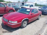 ✅ 2001 Cadillac Eldorado ESC • VIN: 1G6EL12Y31B107932 • Lot: 42723296. Wystawiony na IAAI z przebiegiem 152 482 mil. Bezpłatny archiwum sprzedaży aukcyjnych z USA i szczegółowy raport historii pojazdu na DreamBid. Zdjęcie 6.