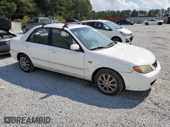 ✅ 2002 Mazda Protege DX • VIN: JM1BJ225X21597889 • Lot: 72237874. Wystawiony na Copart z przebiegiem 254 402 mil. Bezpłatny archiwum sprzedaży aukcyjnych z USA i szczegółowy raport historii pojazdu na DreamBid. Zdjęcie 4.