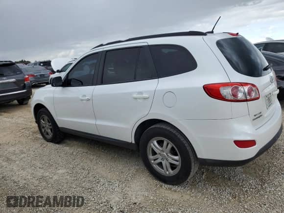 2012 Hyundai Santa Fe GLS with VIN 5XYZG3ABXCG113666, listed as a Copart auction lot 74131604 with 121,303 mi miles and Salvage title. Bid and sale history available at DreamBid. Image 2.