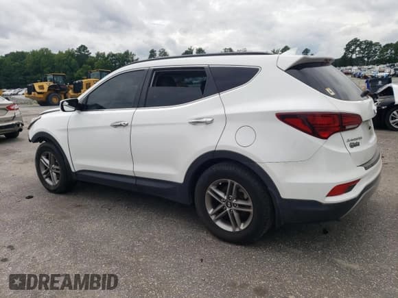 ✅ 2018 Hyundai Santa Fe 2.4L • VIN: 5XYZU3LB4JG515976 • Лот: 64852354. Опубликован ранее на Copart с пробегом 145 375 миль. Бесплатный доступ к архиву аукционных продаж из США и подробный отчёт об истории автомобиля на DreamBid. Изображение 2.