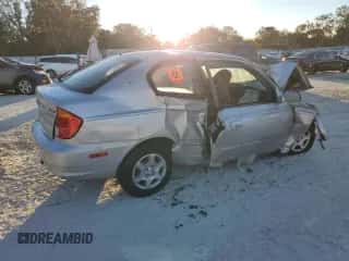 2005 Hyundai Accent GLS z VIN KMHCG35CX5U357839, wystawiony jako Copart lot #81465454 z przebiegiem Nie podano mil oraz Szkoda całkowita • Salvage title. Historia ofert i sprzedaży dostępna na DreamBid. Obrazek 3.