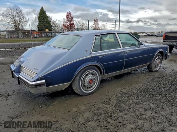 ✅ 1984 Cadillac Seville • VIN: 1G6AS6989EE809567 • Лот: 94370185. Опубликован ранее на Copart с пробегом 1 116 миль. Бесплатный доступ к архиву аукционных продаж из США и подробный отчёт об истории автомобиля на DreamBid. Изображение 3.